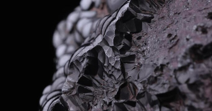 Hematite macro footage detail texture background. close-up raw rough unpolished semi-precious gemstone