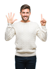 Young handsome man wearing winter sweater over isolated background showing and pointing up with fingers number six while smiling confident and happy.