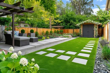 Foto op Plexiglas Backyard garden design with artificial grass, paved patio, plants, fences, and wooden shed © furyon