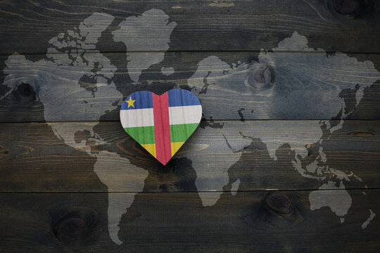 wooden heart with national flag of central african republic near world map on the wooden background. - Powered by Adobe