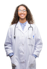 Fototapeta premium Young hispanic doctor woman with a happy face standing and smiling with a confident smile showing teeth