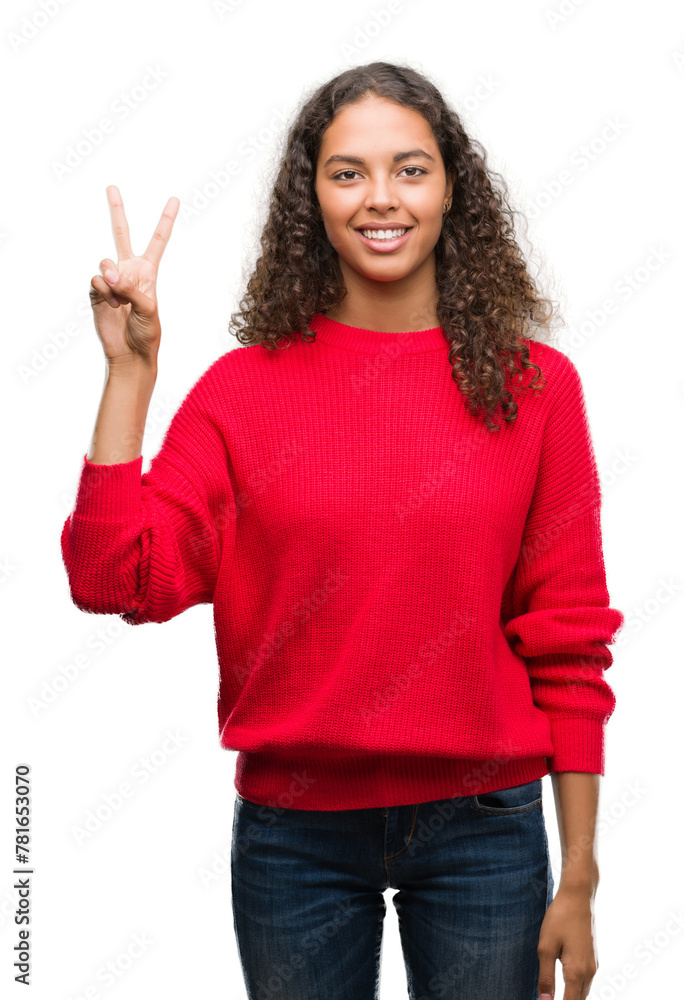 Poster Young hispanic woman wearing red sweater showing and pointing up with fingers number two while smiling confident and happy.