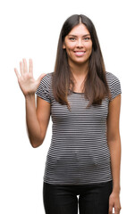 Young beautiful hispanic woman showing and pointing up with fingers number five while smiling confident and happy.