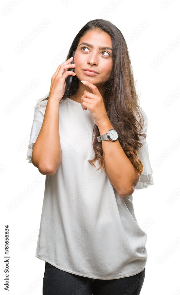 Sticker Young beautiful arab woman talking on the phone over isolated background serious face thinking about question, very confused idea