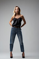 Lace top, denim jeans, elegance stands tall