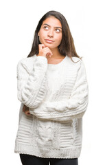 Young beautiful arab woman wearing winter sweater over isolated background with hand on chin...