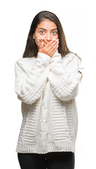 Young beautiful arab woman wearing winter sweater over isolated background shocked covering mouth with hands for mistake. Secret concept.