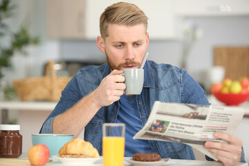 man holding cup of coffee for breakfast