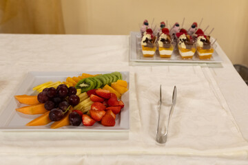 assorted fresh fruit platter and dessert selection at a banquet