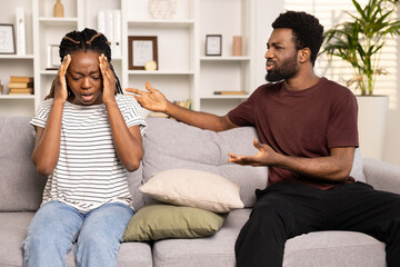 Couple In Conflict On Sofa, Man Explaining To Upset Woman, Relationship Issues, Communication...