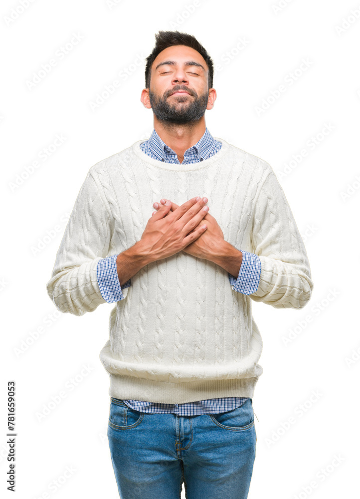 Sticker Adult hispanic man wearing winter sweater over isolated background smiling with hands on chest with closed eyes and grateful gesture on face. Health concept.