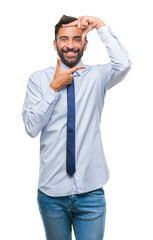 Adult hispanic business man over isolated background smiling making frame with hands and fingers with happy face. Creativity and photography concept.