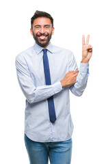 Adult hispanic business man over isolated background smiling with happy face winking at the camera...