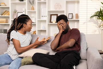 Couple Arguing On Sofa At Home, Miscommunication In Marriage, Relationship Difficulties, Indoor...