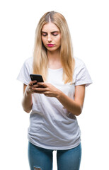 Young beautiful blonde woman using smartphone over isolated background with a confident expression on smart face thinking serious