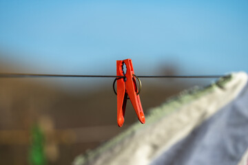 Red clothespin on a rope, stock image