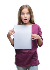 Fototapeta premium Young beautiful girl holding blank sheet paper over isolated background scared in shock with a surprise face, afraid and excited with fear expression