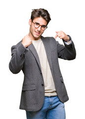 Young business man wearing glasses over isolated background looking confident with smile on face,...