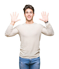 Naklejka premium Young handsome man over isolated background showing and pointing up with fingers number ten while smiling confident and happy.