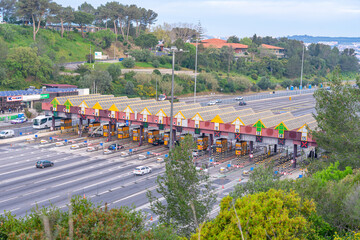 Toll booths with car circulation on access to the 25 de Abril bridge. Almada-Portugal.