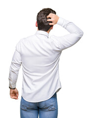 Young business man wearing glasses over isolated background Backwards thinking about doubt with hand on head