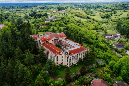 Aerial view of ruined overgrown old abandoned Soviet sanatorium Gelati, Tskaltubo, Georgia