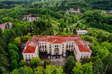 Aerial view of ruined overgrown old abandoned Soviet sanatorium Metallurgist, Tskaltubo, Georgia - obrazy, fototapety, plakaty