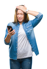 Young beautiful caucasian woman texting sending message using smartphone over isolated background...