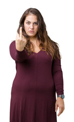 Beautiful and attractive plus size young woman wearing a dress over isolated background Showing...