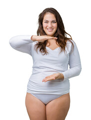 Beautiful plus size young overwight woman wearing white underwear over isolated background...
