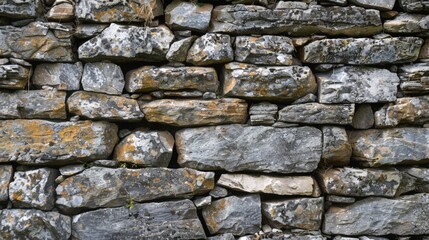 Close up of stone wall with yellow lichen