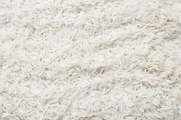 Raw basmati rice as background, top view