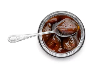  Jar of tasty sweet fig jam and spoon isolated on white, top view © New Africa