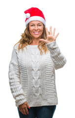 Middle age senior hispanic woman wearing christmas hat over isolated background showing and pointing up with fingers number five while smiling confident and happy.