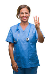 Middle age senior nurse doctor woman over isolated background showing and pointing up with fingers number three while smiling confident and happy.