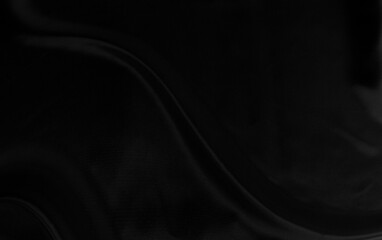 Black gray satin dark fabric texture luxurious shiny that is abstract silk cloth background with patterns soft waves blur beautiful.