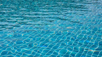 swimming pool water background, pool water surface with turquoise blue mosaic