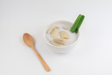 Banana in coconut milk (Kluay Buat Chi) on white background. Popular Traditional dessert of asian, Thailand.
