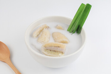 Banana in coconut milk (Kluay Buat Chi) on white background. Popular Traditional dessert of asian, Thailand.