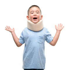 Dark haired little child injured wearing neck collar very happy and excited, winner expression...