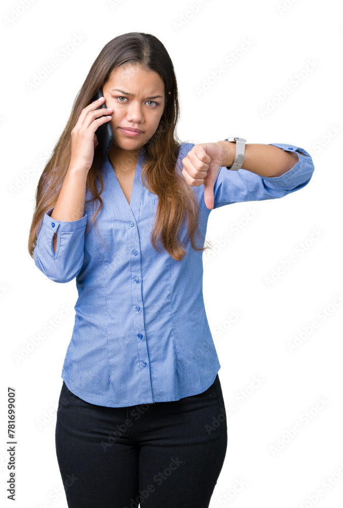 Sticker young beautiful brunette business woman talking on smartphone over isolated background with angry fa