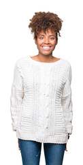 Beautiful young african american woman wearing winter sweater over isolated background with a happy and cool smile on face. Lucky person.