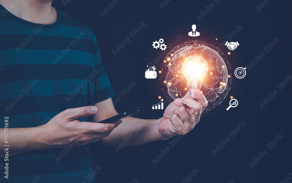 Poster man holds light bulb and uses smart phone with virtual global internet connection