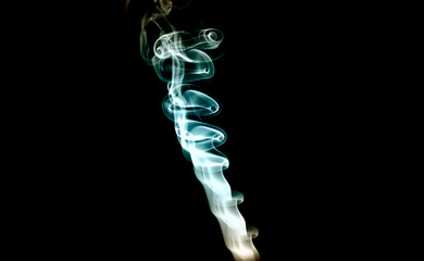 smoke flowing in an air on black background