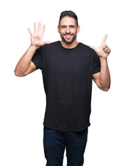 Young handsome man over isolated background showing and pointing up with fingers number seven while smiling confident and happy.