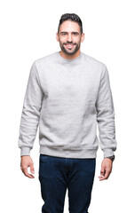 Young handsome man wearing sweatshirt over isolated background with a happy and cool smile on face....