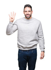 Young handsome man wearing sweatshirt over isolated background showing and pointing up with fingers number four while smiling confident and happy.