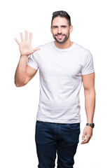 Young man wearing casual white t-shirt over isolated background showing and pointing up with fingers number five while smiling confident and happy.