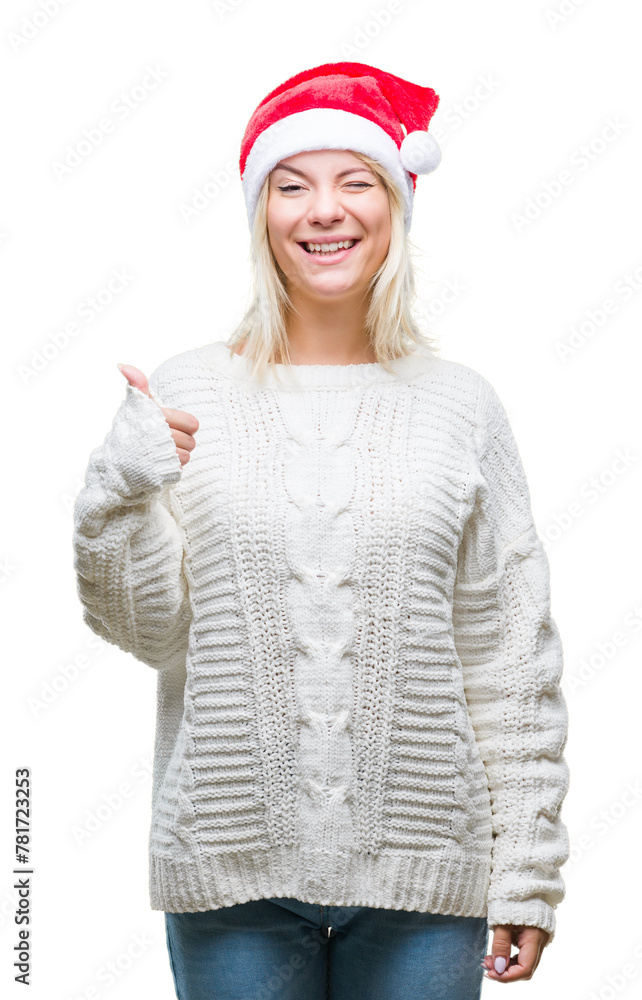 Poster young beautiful blonde woman wearing christmas hat over isolated background doing happy thumbs up ge