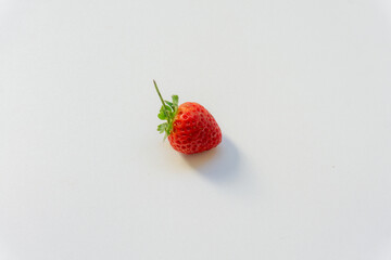 Red berry strawberry with leaves isolated on white background